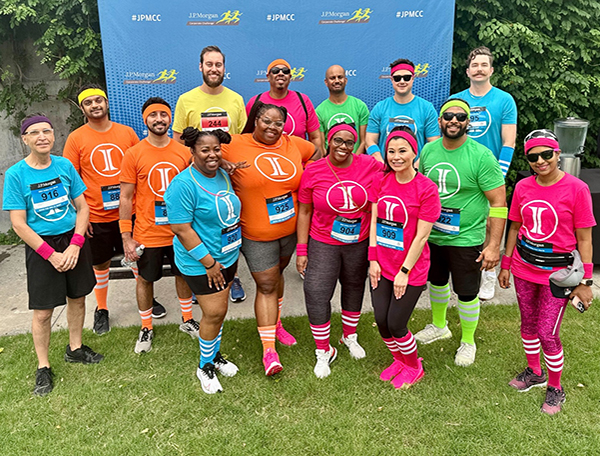 People standing in bright shirts together